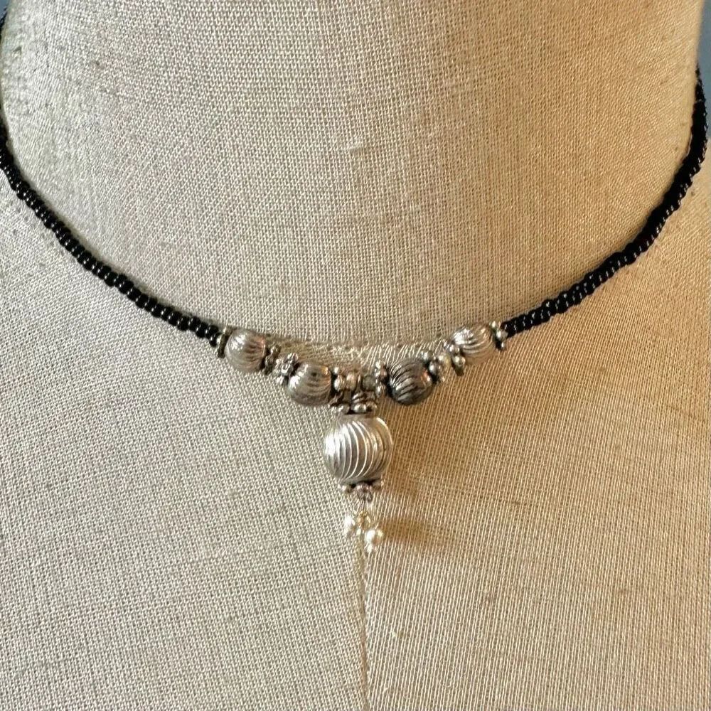 Black beaded silver tone choker necklace